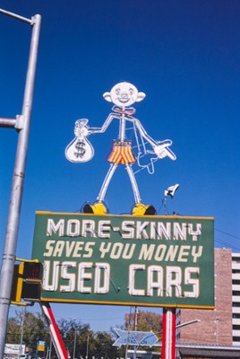 More Skinny Used Car Sign on Santa Fe Avenue in Pueblo, Colorado - Classic Black & White Print On A Wall